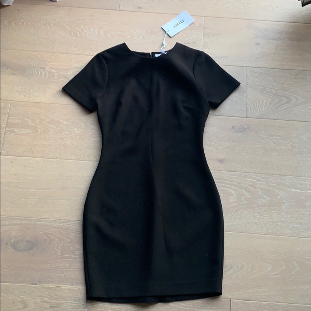 Likely black Manhattan dress
